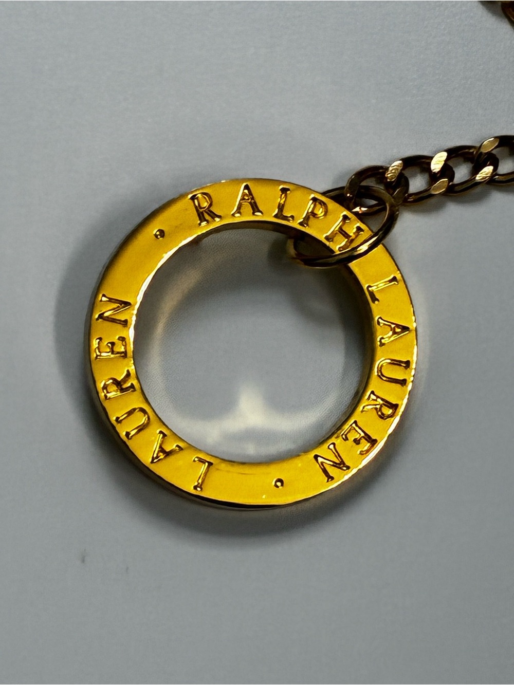 Ralph Lauren Gold-Tone Ring Necklace or chain belt features circular toggle